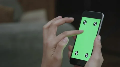Woman using a green screen iphone Stock Footage 59771275
