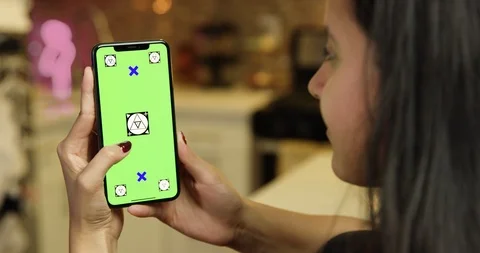 Woman using green screen phone Stock Footage 96310153