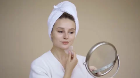Woman Using Gua Sha Stone. Young beautiful woman Gua Sha stone for Lymphatic Stock Footage 142201090