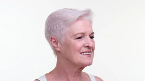 Woman Using Gua Sha Tool for Facial Massage on White Background Video stock 254442377