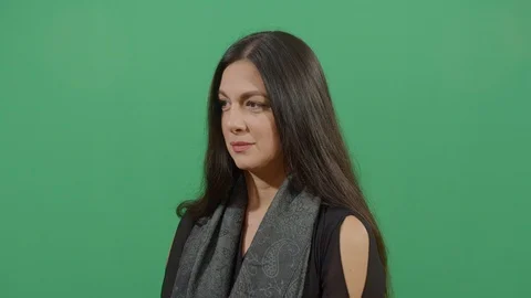 Woman using the hand as a shade studio isolated shot against green screen Stock-Footage 117976801