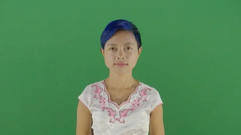 Woman using the hand as a shade studio isolated shot against green screen Stock Footage 126308290
