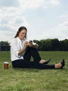 Woman using a handheld computer Stock Photos