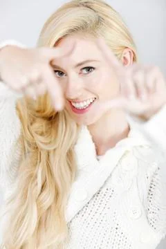 Woman using hands to frame Фото