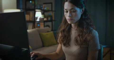 Woman using her computer and smartphone Stock Footage 162996703