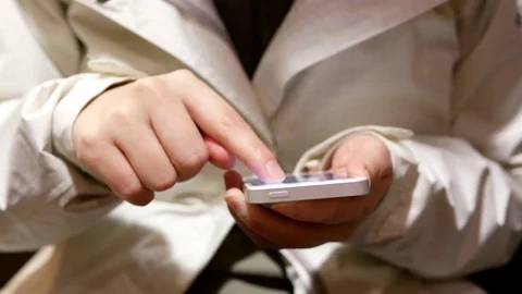 Woman using her mobile phone inside Mcdonalds restaurant Stock Footage 69843059
