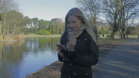 Woman using her smartphone Stock Footage 61363796