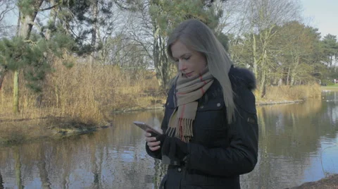 Woman using her smartphone Stock Footage 61363818