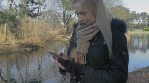 Woman using her smartphone Stock Footage 61363898
