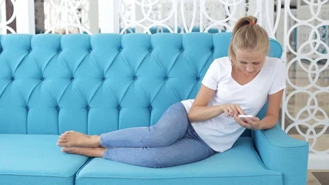 Woman using her smartphone Stock Footage 76492680