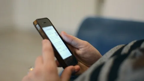 Woman using her smartphone Stock Footage 93513697