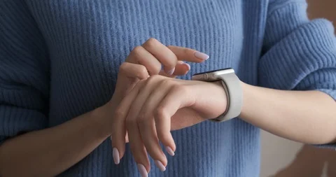 Woman using her smartwatch touchscreen technology device. Stock Footage 104405683