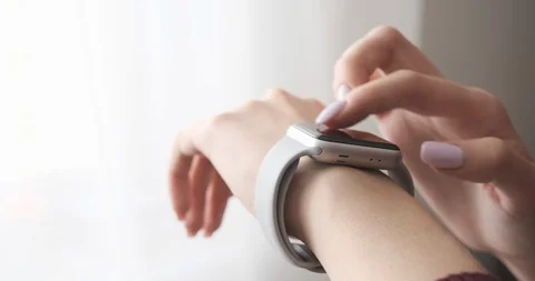 Woman using her smartwatch touchscreen technology device. Video stock 104406468