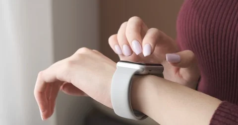 Woman using her smartwatch touchscreen technology device. Stock Footage 104406519