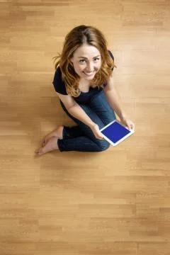 Woman using her tablet computer Foto stock