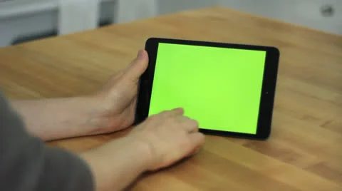 Woman Using Horizontal Tablet on Table - Various Hand Gestures - Green Screen Stock Footage 24204947