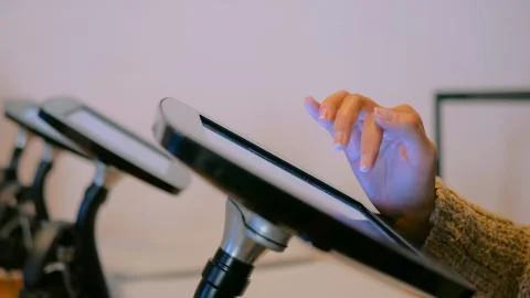 Woman using interactive display tablet at jewish modern history museum Stock Photos