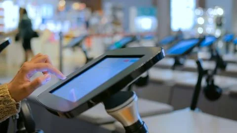 Woman using interactive display tablet at jewish modern history museum Stock Photos