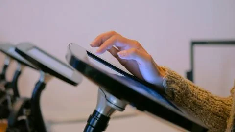 Woman using interactive display tablet at jewish modern history museum Stock Photos