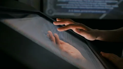 Woman using interactive touchscreen display at modern history museum Stock Footage 95654486