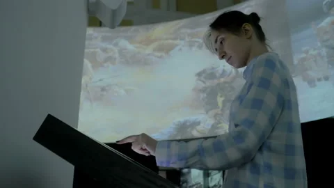 Woman using interactive touchscreen display at modern history museum Stock Footage 106026568