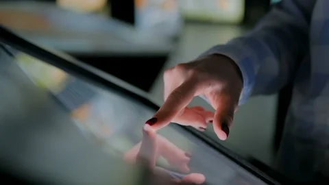 Woman using interactive touchscreen display at modern history museum Stock Footage 106028853