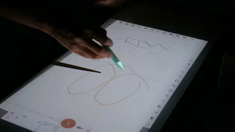 Woman using interactive touchscreen projector display for drawing at exhibition Stock Footage 94256621