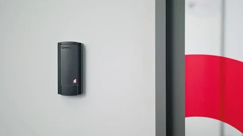 Woman Using Intercom at Residential Building Stock Footage 82648209