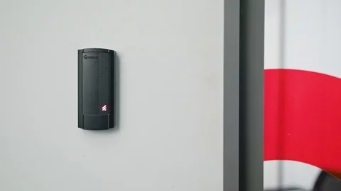 Woman Using Intercom at Residential Building Stock Footage 82649383