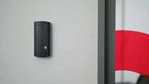 Woman Using Intercom at Residential Building Stock Footage 82649913