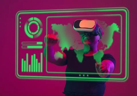 Woman using interface modern technology and digital layer effect, VR-headset as Stock Photos