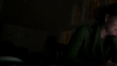 A woman using the internet alone in dark Stock Footage 70260236