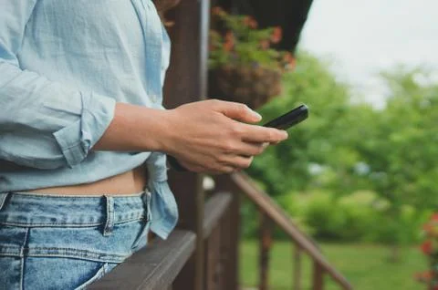 Woman using Internet in the countryside. Good internet communication concept. Stock Photos