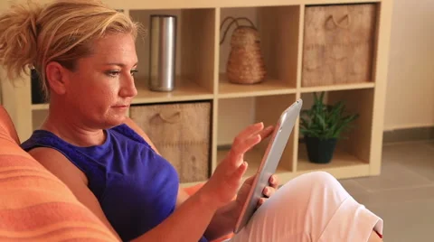 Woman using ipad Stock Footage 53233043