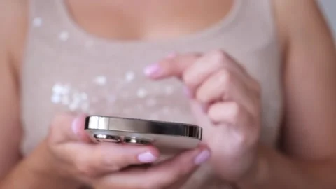 Woman using iPhone 14 Pro. Online shopping. 21.07.23 Minsk, Belarus Stock Footage 247404961