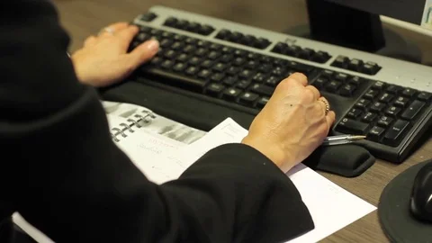 Woman using keyboard Stock Footage 77046947