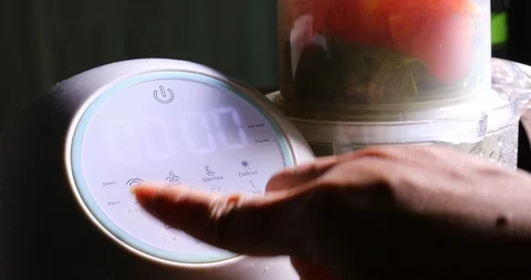 Woman using kitchenware multi-functional electric household appliance food steam Stock Footage 86785512