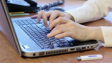 Woman using laptop and inserting USB flash drive Stock Footage 46410512