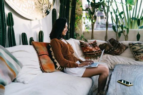 Woman using laptop for browsing while having break Stock Photos