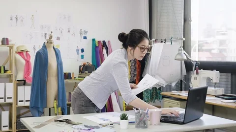 Woman using laptop checking with sketches Stock Footage 111312216