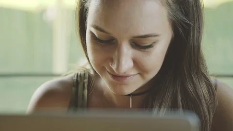 Woman using laptop computer in coffee shop, working in mobile office Stock Footage 73047224