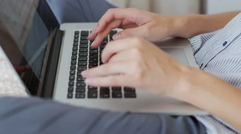 Woman using laptop computer at her home Stock Footage 66455569