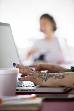 Woman using laptop computer Stock Photos