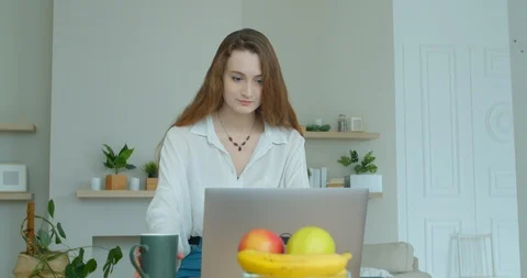 Woman using laptop computer. Portrait of business woman watching news at laptop Stock Footage 126647357
