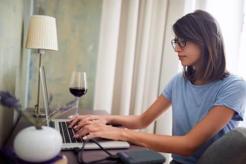 Woman using a laptop computer.Remote work from home. Internet work at home. F Stock Photos