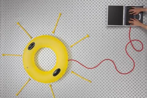 Woman using laptop connected with float forming sun shape Fotos Stock