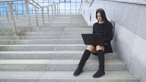 Woman using a laptop Stock Footage 76467305