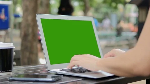 Woman using laptop Green Screen on table work place Видео 81265764