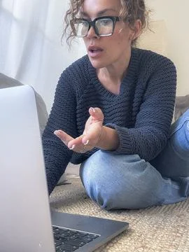 Woman using laptop for remote work and video call, casual home office conve.. Stock Photos