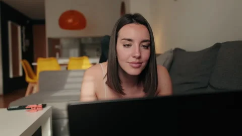 Woman Using Laptop on Sofa at Home Stock Footage 305337369